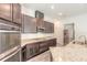 Modern kitchen with stainless steel appliances and granite countertops at 462 Tuscany Chase Dr, Daytona Beach, FL 32117