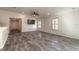 Spacious living area with large windows and wood-look tile floor at 462 Tuscany Chase Dr, Daytona Beach, FL 32117