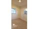 Bright bedroom with tile floors and two windows at 5108 Cassatt Ave, Orlando, FL 32808