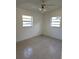 Spacious bedroom with tile floors and ceiling fan at 5108 Cassatt Ave, Orlando, FL 32808