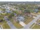 Aerial view of the property with pool and surrounding neighborhood, showcasing its location and community at 559 Eagle Dr, Daytona Beach, FL 32117