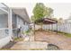 Cozy backyard featuring a picnic table under a canopy, perfect for outdoor gatherings and relaxation at 559 Eagle Dr, Daytona Beach, FL 32117