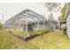 Landscaped backyard with pool and shed at 559 Eagle Dr, Daytona Beach, FL 32117