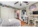 Well-lit bedroom with a ceiling fan, ample storage, and a comfortable bed, creating a cozy and inviting space at 559 Eagle Dr, Daytona Beach, FL 32117