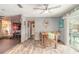 Open dining area with direct access to a cozy living room and view of the outdoor pool at 559 Eagle Dr, Daytona Beach, FL 32117