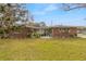 Charming single-story home featuring manicured lawn and well-maintained landscaping at 559 Eagle Dr, Daytona Beach, FL 32117