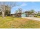 Charming single-story home featuring a wide driveway and well-maintained lawn at 559 Eagle Dr, Daytona Beach, FL 32117