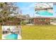 Charming single-story home featuring a screened-in pool and well-maintained landscaping at 559 Eagle Dr, Daytona Beach, FL 32117