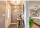 Welcoming foyer featuring a stylish entryway table and a view into the bedroom at 559 Eagle Dr, Daytona Beach, FL 32117