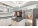Spacious kitchen featuring a center island with seating that flows into other rooms at 559 Eagle Dr, Daytona Beach, FL 32117