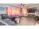 Cozy living room with a sectional sofa, TV, and decorative curtains at 559 Eagle Dr, Daytona Beach, FL 32117