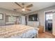 Main bedroom features hardwood floors, dresser, and attached bathroom at 559 Eagle Dr, Daytona Beach, FL 32117