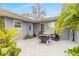 Inviting outdoor patio space with comfortable seating and decorative plants at 559 Eagle Dr, Daytona Beach, FL 32117