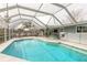 Beautiful pool area with a screened enclosure, providing a great space for outdoor entertainment and relaxation at 559 Eagle Dr, Daytona Beach, FL 32117