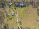 Bird's-eye view showcasing home, pool, and surrounding land at 601 Rasley Rd, New Smyrna Beach, FL 32168