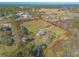 Aerial view of house and expansive lot with outbuildings at 601 Rasley Rd, New Smyrna Beach, FL 32168