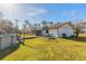 House exterior and backyard with pool and patio at 601 Rasley Rd, New Smyrna Beach, FL 32168