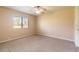 Spacious bedroom with ceiling fan and carpet at 601 Rasley Rd, New Smyrna Beach, FL 32168