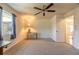 Bright bedroom with ceiling fan and carpet at 601 Rasley Rd, New Smyrna Beach, FL 32168