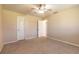 Empty bedroom with ceiling fan and carpet at 601 Rasley Rd, New Smyrna Beach, FL 32168
