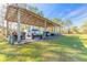Covered carport providing parking and storage space at 601 Rasley Rd, New Smyrna Beach, FL 32168