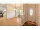 Bright dining area with wood floors and kitchen access at 601 Rasley Rd, New Smyrna Beach, FL 32168