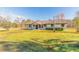 Ranch style home with a large green yard at 601 Rasley Rd, New Smyrna Beach, FL 32168