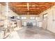 Spacious garage with wooden beams and ample storage at 601 Rasley Rd, New Smyrna Beach, FL 32168