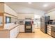 Eat-in kitchen includes a laundry area and pantry at 601 Rasley Rd, New Smyrna Beach, FL 32168