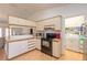 Modern kitchen with stainless steel appliances and updated cabinets at 601 Rasley Rd, New Smyrna Beach, FL 32168