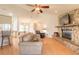 Spacious living room featuring a stone fireplace and comfy seating at 601 Rasley Rd, New Smyrna Beach, FL 32168