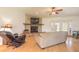 Living room with a stone fireplace and access to the backyard at 601 Rasley Rd, New Smyrna Beach, FL 32168
