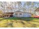 Detached outbuilding with single door and windows at 601 Rasley Rd, New Smyrna Beach, FL 32168