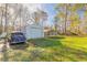 Detached garage and carport in a grassy yard at 601 Rasley Rd, New Smyrna Beach, FL 32168