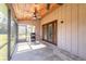 Spacious screened porch with ceiling fan and access to backyard at 601 Rasley Rd, New Smyrna Beach, FL 32168