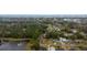 Aerial view showcasing the house's neighborhood and a pond at 639 Florida Ave, Daytona Beach, FL 32117