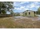 House with backyard, wooden fence, and a paved area at 639 Florida Ave, Daytona Beach, FL 32117