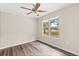 Bedroom with wood-look floors and ceiling fan at 639 Florida Ave, Daytona Beach, FL 32117