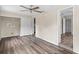 Spacious bedroom with wood-look floors and ceiling fan at 639 Florida Ave, Daytona Beach, FL 32117