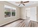 Charming bedroom with wood-look floors and a view of the backyard at 639 Florida Ave, Daytona Beach, FL 32117