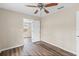 Bedroom with wood-look floors and ceiling fan at 639 Florida Ave, Daytona Beach, FL 32117