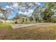Backyard view of a house with a large paved area at 639 Florida Ave, Daytona Beach, FL 32117
