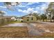 Backyard view of a house with a large paved area at 639 Florida Ave, Daytona Beach, FL 32117