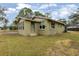 Side view of a light green brick house at 639 Florida Ave, Daytona Beach, FL 32117