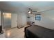 Bright bedroom featuring a ceiling fan and wood-look tile flooring at 744 Baywood Ln, South Daytona, FL 32119
