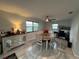 Bright dining area with ceiling fan, buffet, and natural light at 744 Baywood Ln, South Daytona, FL 32119