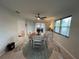 Dining room with a ceiling fan, and a view to the outside patio at 744 Baywood Ln, South Daytona, FL 32119