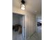 Hallway leading to bedroom with closet and additional storage space at 744 Baywood Ln, South Daytona, FL 32119