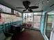 Enclosed patio with decorations, ceiling fan, and outdoor seating at 744 Baywood Ln, South Daytona, FL 32119