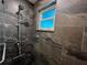 Modern shower featuring marble-style tile and adjustable shower head at 744 Baywood Ln, South Daytona, FL 32119